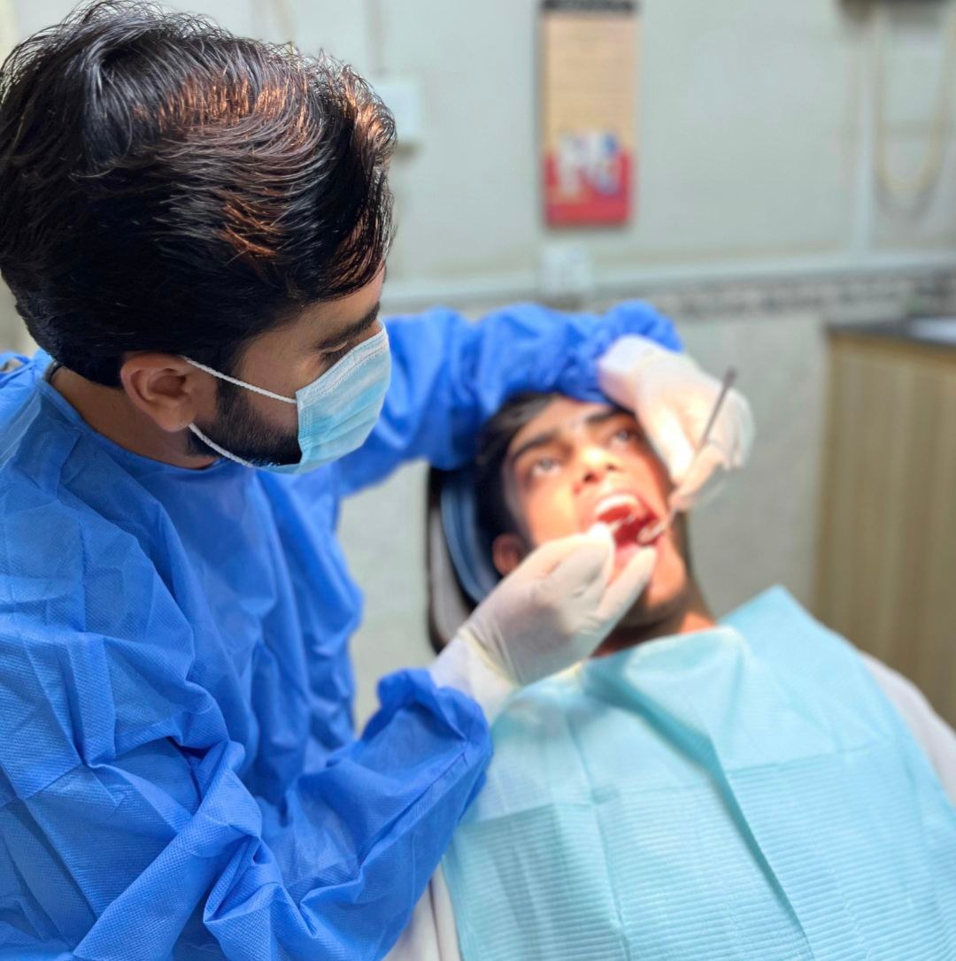 Dr. Muhammad Siddique performing dental examination